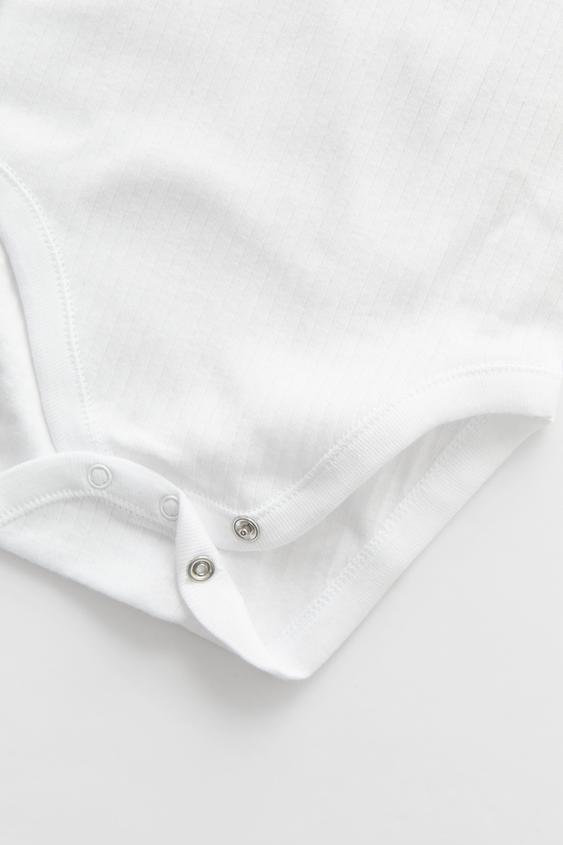 Zara THREE-PACK OF ROUND NECK SHORT SLEEVE BODYSUITS