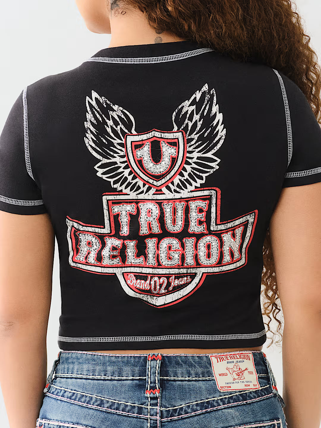 TRUE RELIGION FLATLOCK WINGED CRYSTAL LOGO BABY TEE
