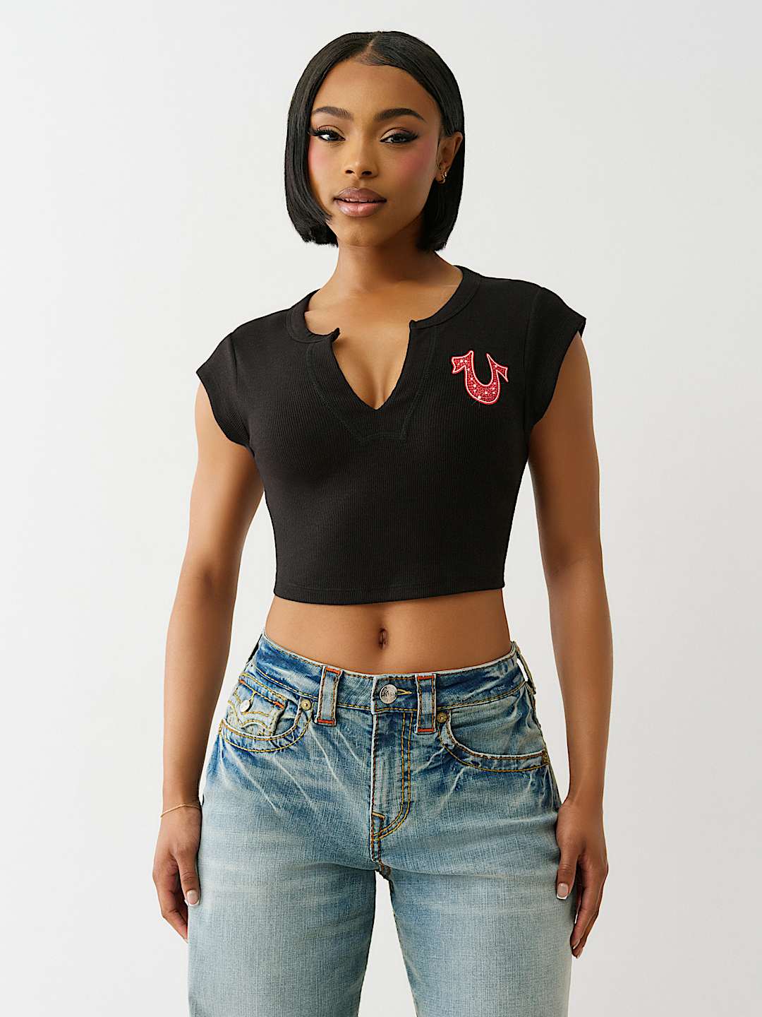TRUE RELIGION ONLINE EXCLUSIVE CRYSTAL LOGO NOTCH BABY TEE