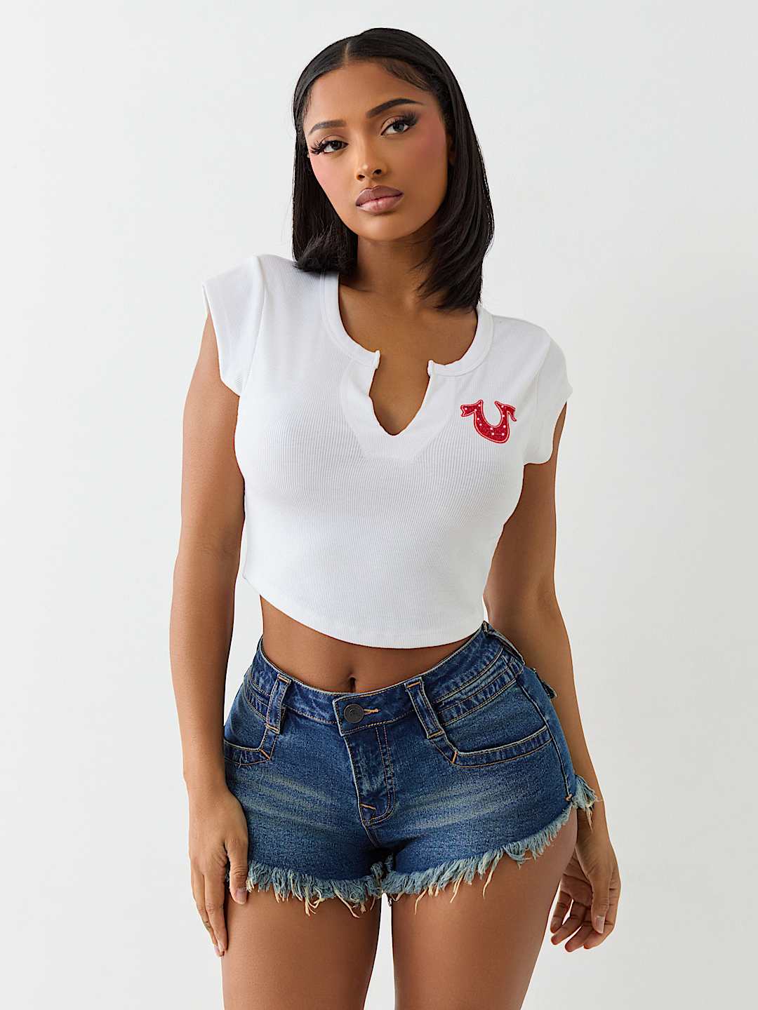 TRUE RELIGION ONLINE EXCLUSIVE CRYSTAL LOGO NOTCH BABY TEE