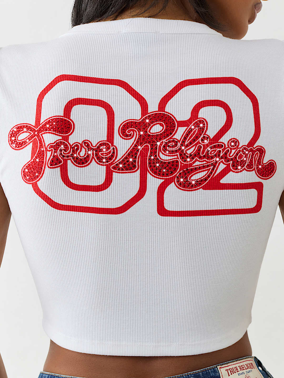 TRUE RELIGION ONLINE EXCLUSIVE CRYSTAL LOGO NOTCH BABY TEE