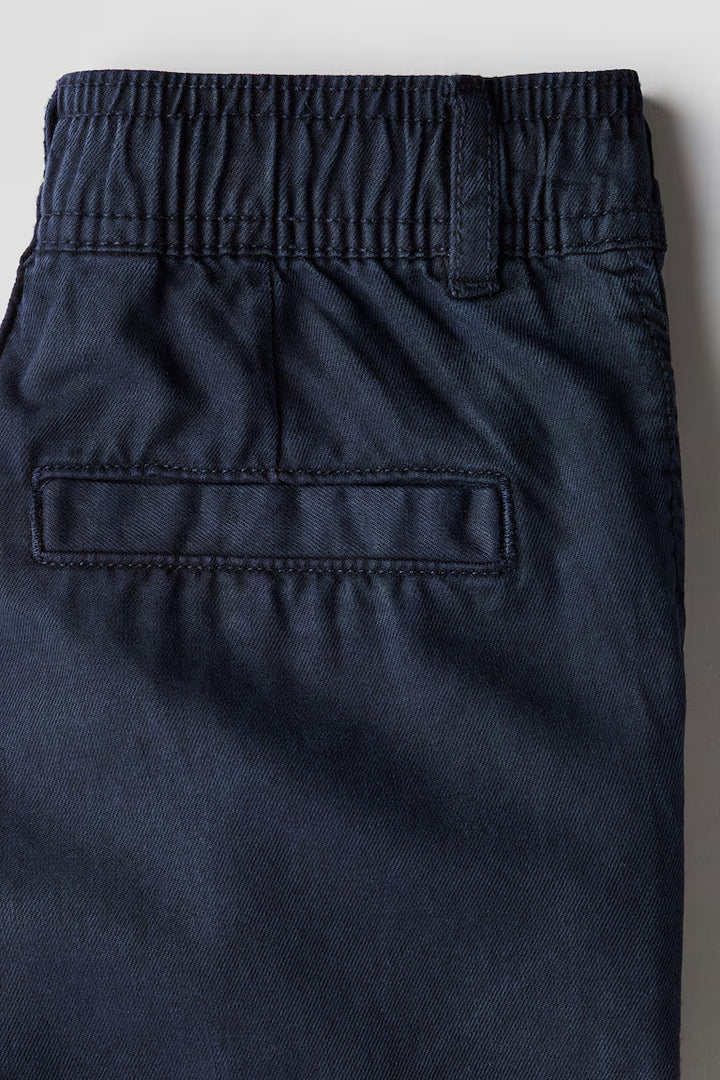 H&M LOOSE-FIT TAPERED TWILL CHINOS