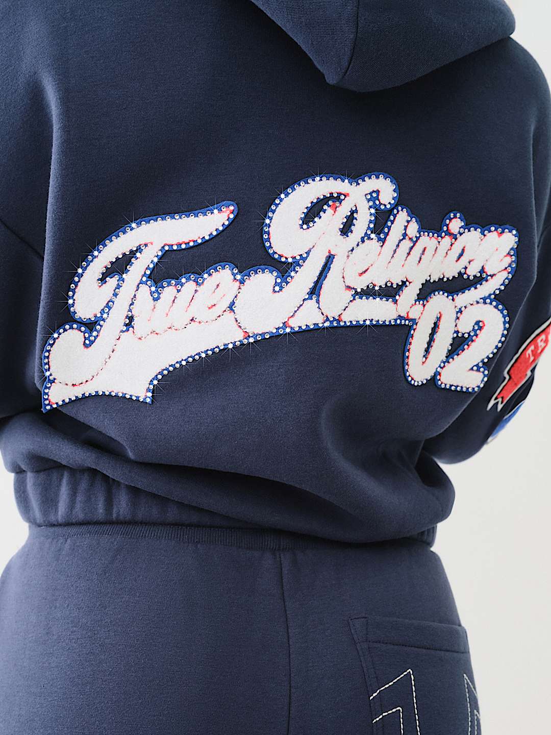 TRUE RELIGION CRYSTAL PATCH ZIP VARSITY HOODIE