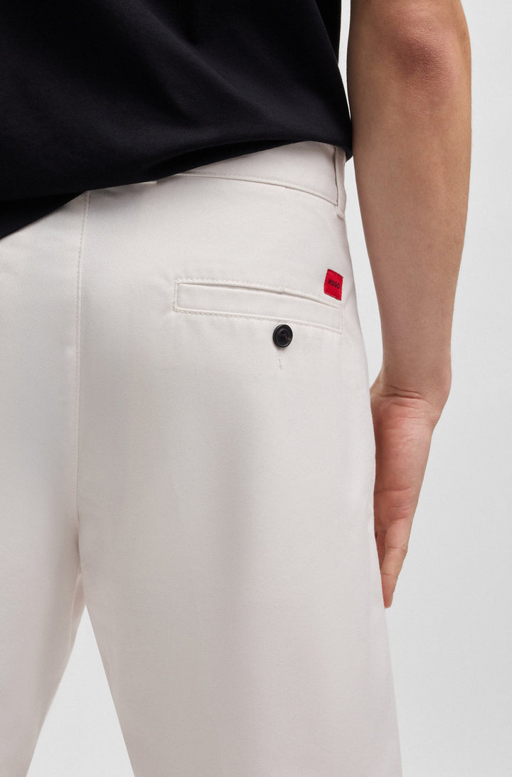 Hugo Regular-fit shorts with slim leg and buttoned pockets