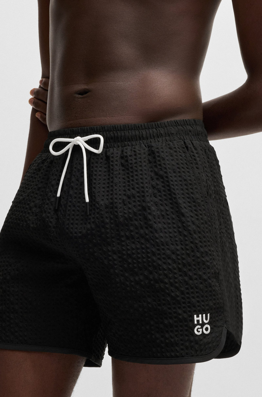 Hugo Waffle-structured swim shorts with embroidered stacked logo