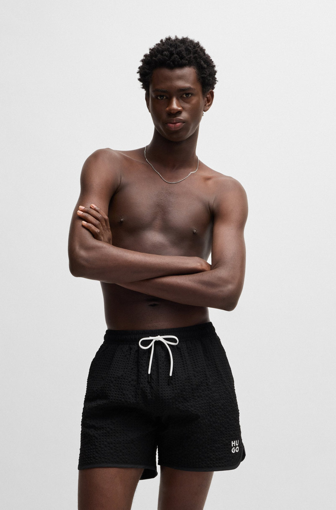 Hugo Waffle-structured swim shorts with embroidered stacked logo