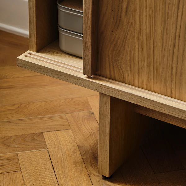 IKEA STOCKHOLM 2025 TV unit with sliding doors, oak veneer, 70 3/8x16 1/2x22 1/8 "