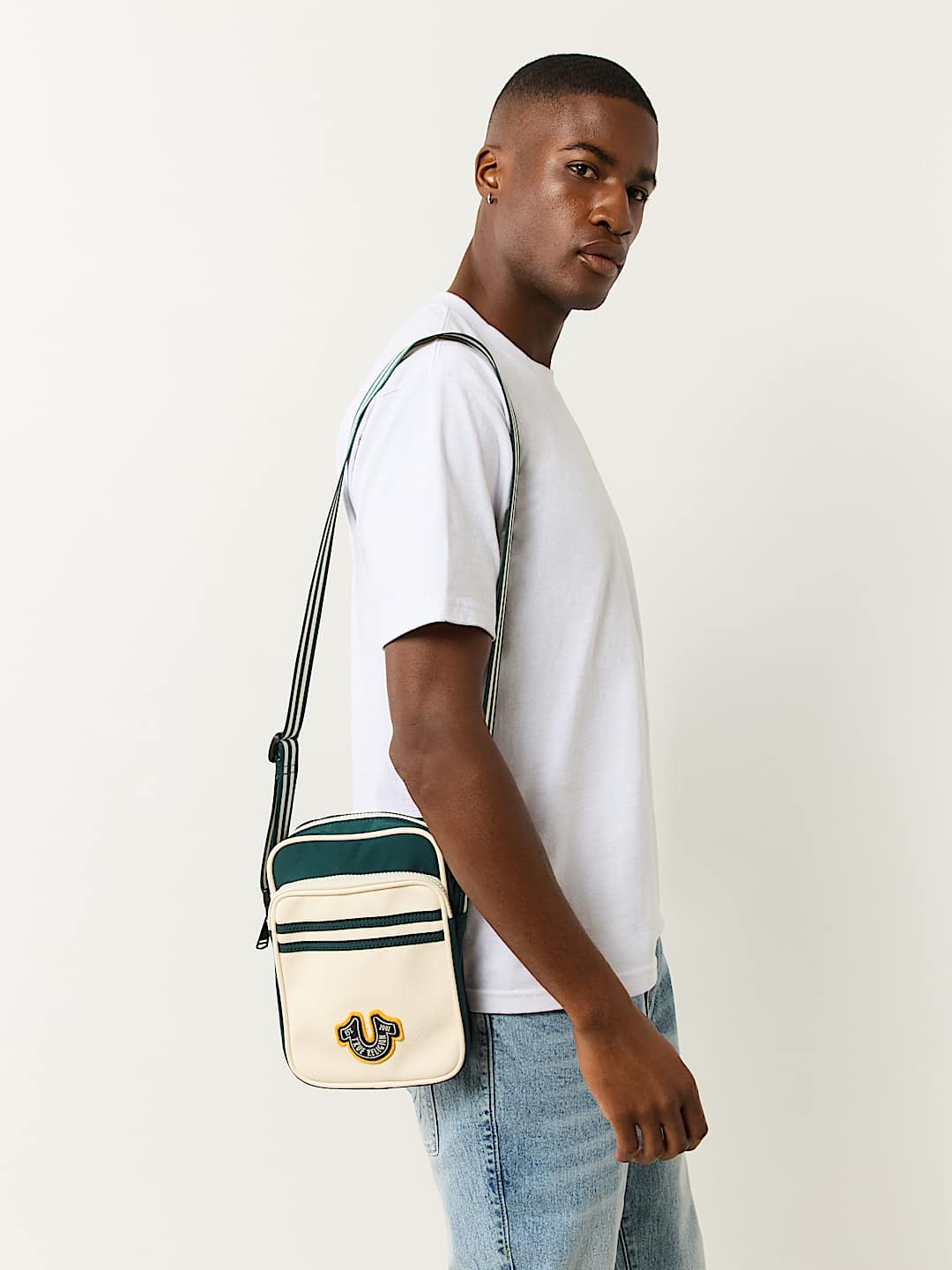 TRUE RELIGION COLLEGIATE SLING BAG