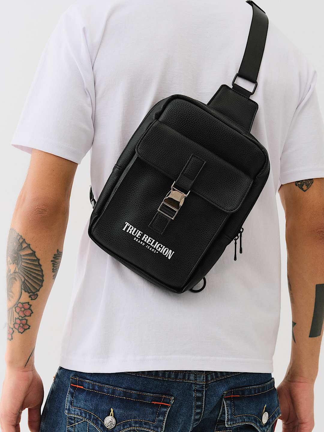 TRUE RELIGION METAL CLASP LOGO SLING BAG